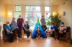 Eight care workers posing for a photo