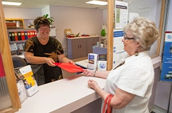 Woman checking in at the front desk