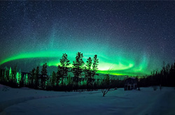 Bright green Northern lights across the sky