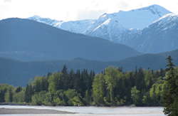 View of the Skeena River with snowcapped mountains in the background
